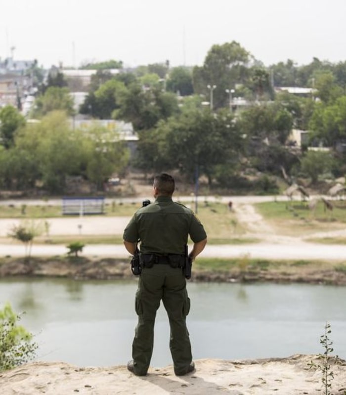 Image of a Department of Homeland Security agent overlooking the Rio Grande River